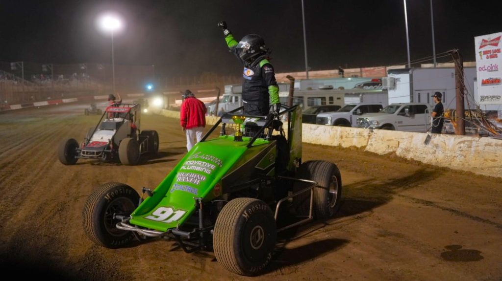 Brody Roa celebrates victory in the Big Chino Ranch sponsored #91R sprint car at Perris Auto Speedway.